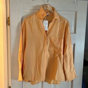 Orange blouse by Ming